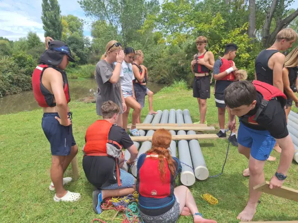 teens camp raft building